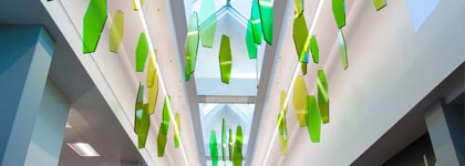 A ceiling art piece that looks like glass leaves