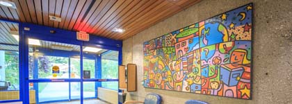 An entrance shot where a colourful mural is painted on the wall.