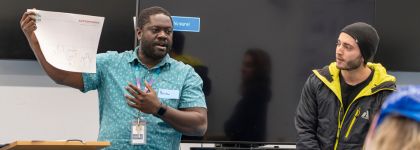 Man presenting an idea to collogues.