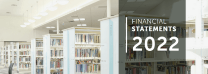 Photograph of bookshelves. The text on the right of the photo reads "financial statements 2022."