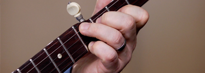 A picture of someone playing the banjo. 