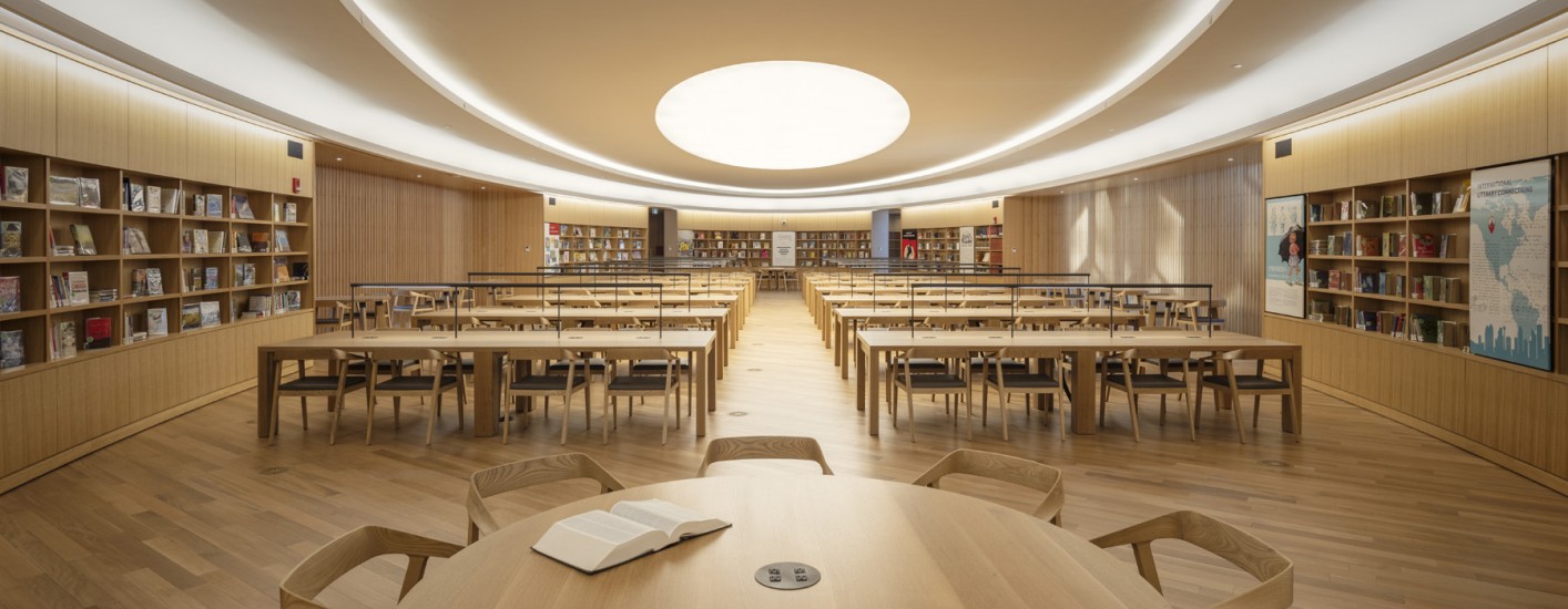 A photograph of the  space where, surrounded by wood-paneled walls and special collections, a bibliophile can read or study to their heart’s content.