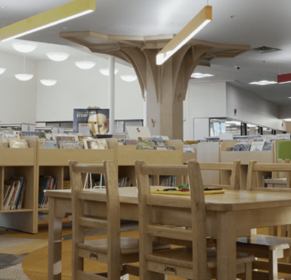 Photograph of the interior of a Calgary Public Library location. On the photo are also illustrations of red flowers. 