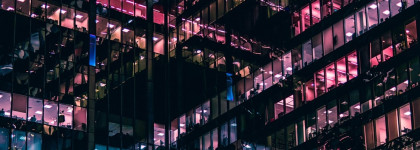 A visual of windows of skyscrapers lit up. 