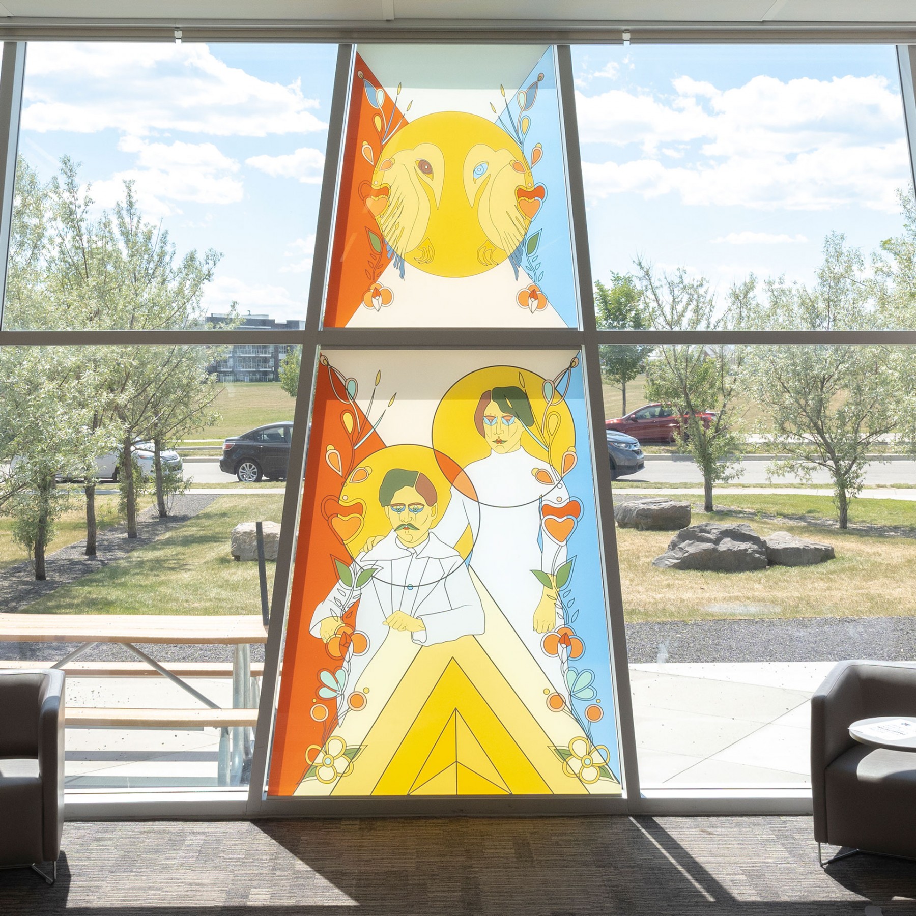 background image: An image of the traditional coloured glass Indigenous Placemaking art piece at Seton Library.
