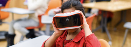 An image of a girl holding a view master.