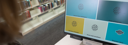 A computer monitor displaying a library system designed for browsing or managing user accounts.