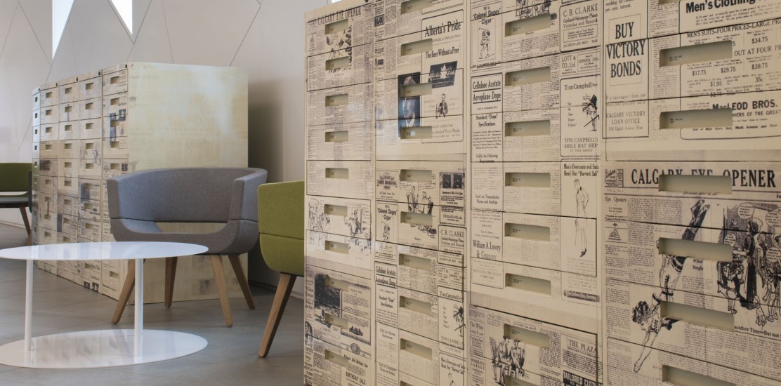 Modern office space with unique newspaper-themed storage units.