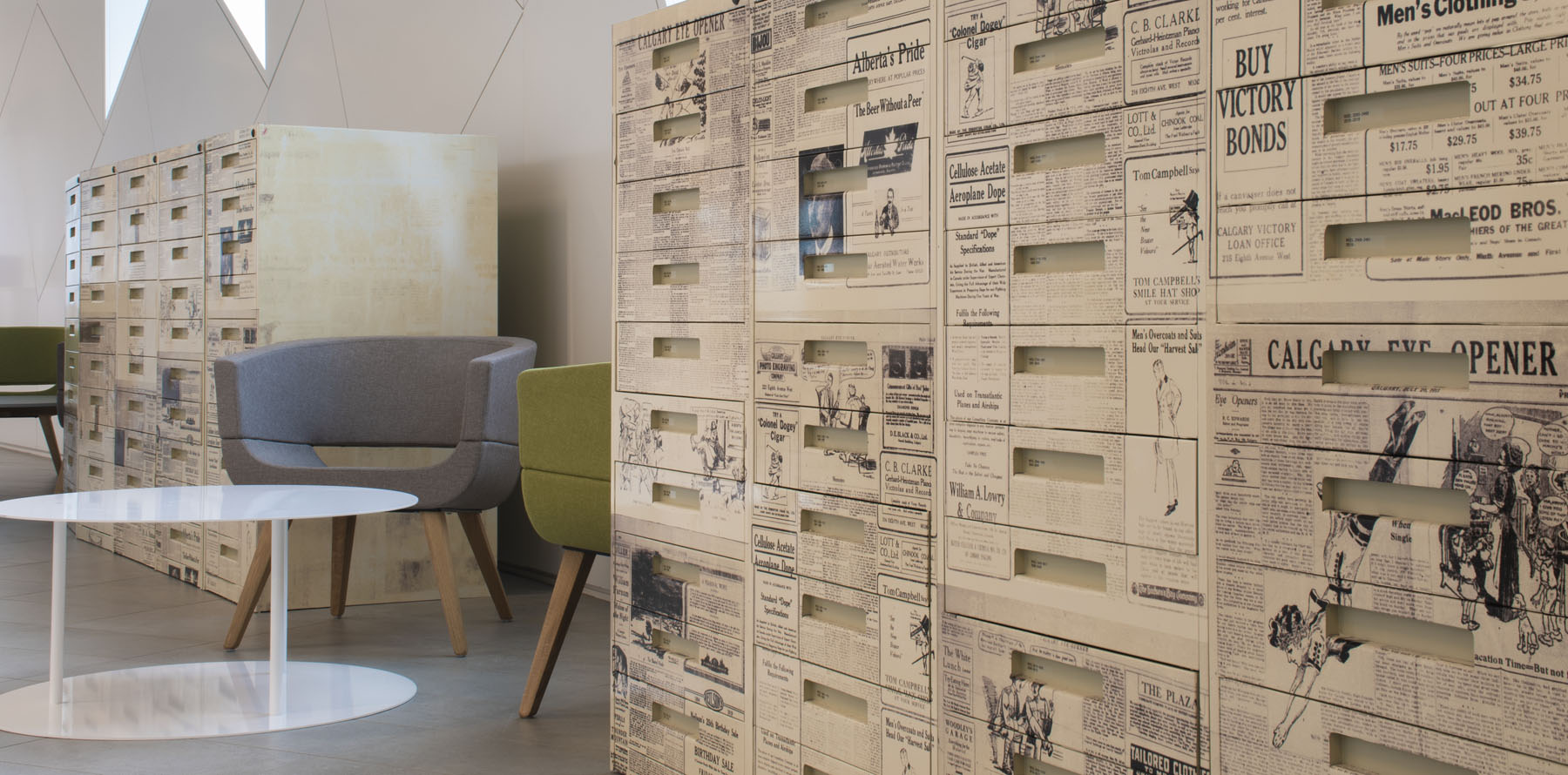 background image: Modern office space with unique newspaper-themed storage units.
