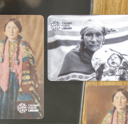 A photo of the Library membership cards available that feature family photographs of Tsuut'ina artist Glenna Cardinal.