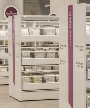 Library shelves with accessible materials such as Talking Books.