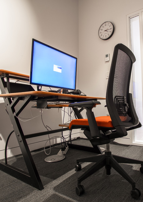 A photograph of a computer on a desk that is used for Post-Production.