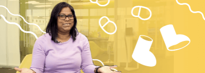 This is a picture of a staff member sitting on a chair and smiling at the camera. She is on a yellow background, and beside her are illustrations of walking feet and boots.