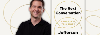 Jefferson Fisher with a copy of his book The Next Conversation