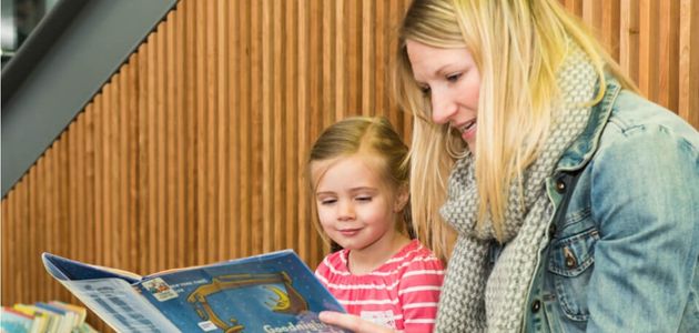 Woman and girl reading