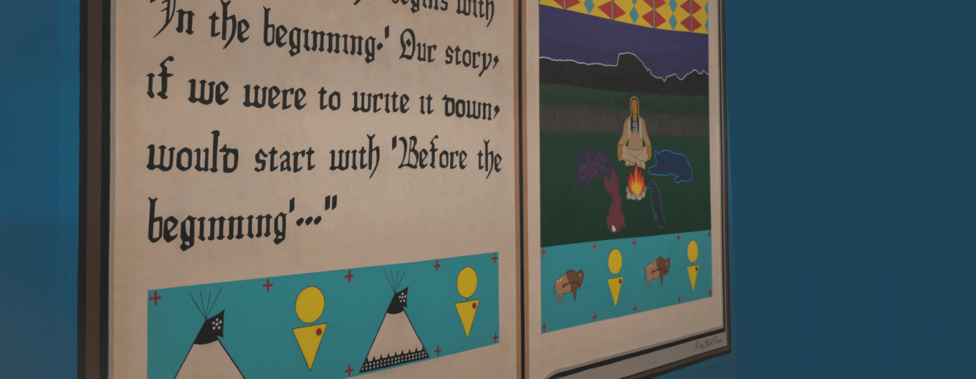 A painting of an open book. The left page has text stating, The European story always begins with 'in the beginning.' Our story...would start with 'Before the Beginning'" The right page shows a stylized scene with a teepee and campfire. 