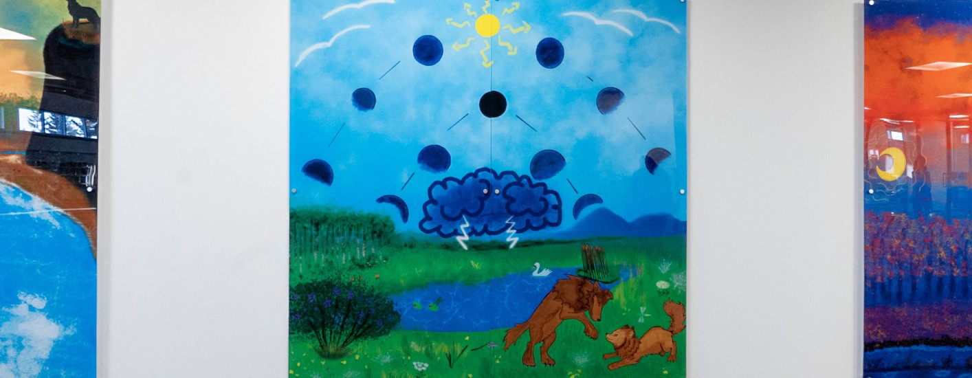 A painting of two wolves playing in a field with a thunderstorm nearby.