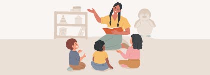 An adult reads a book to three children sitting on the floor of a daycare facility.