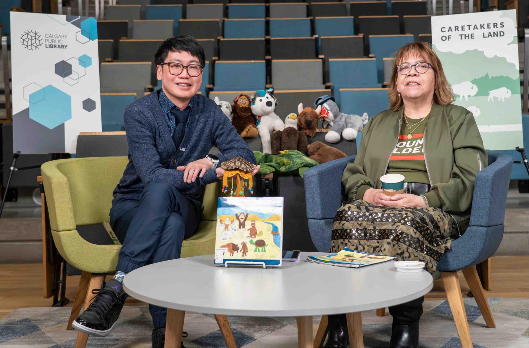 background image: Caretakers of the Land with Rapheal and Crystal Manyfingers