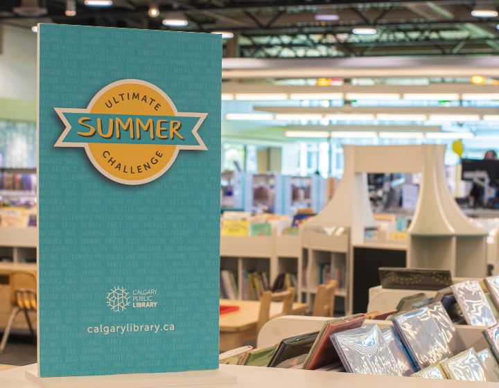 background image: A library with a poster in the foreground with the text Ultimate Summer Challenge