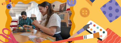 Two people create paper crafts at a table, framed by colorful illustrations of art supplies.