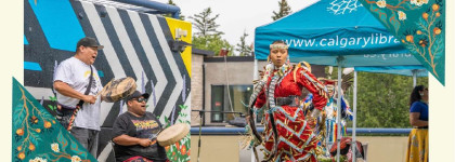 Photo of Indigenous drummers and dancers at a Library hosted outdoor Powwow