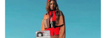 Teal background featuring a person wearing red and brown with a cassette tape in front of her for Pretty Dangerous Four Acts on Womanhood