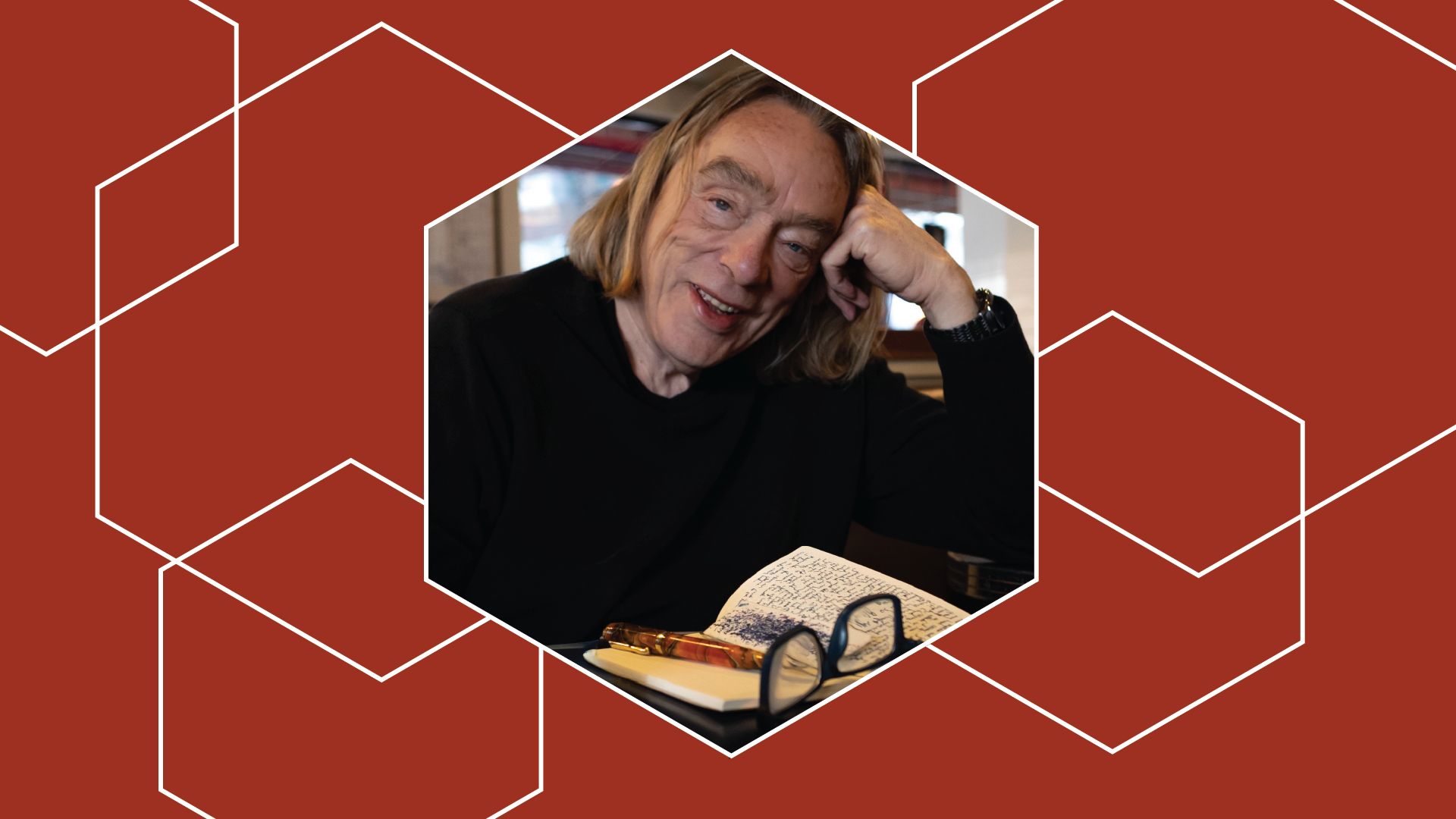 Image of author in residence Eugene Stickland on a red background with geometric shapes