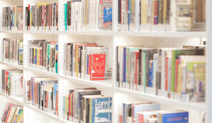 Photograph of a shelf filled with various books. 