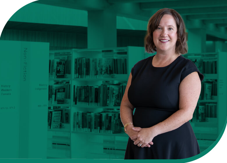Sarah Meilleur standing in front of library bookshelves, wearing a dark dress, with a teal overlay applied to the library background.