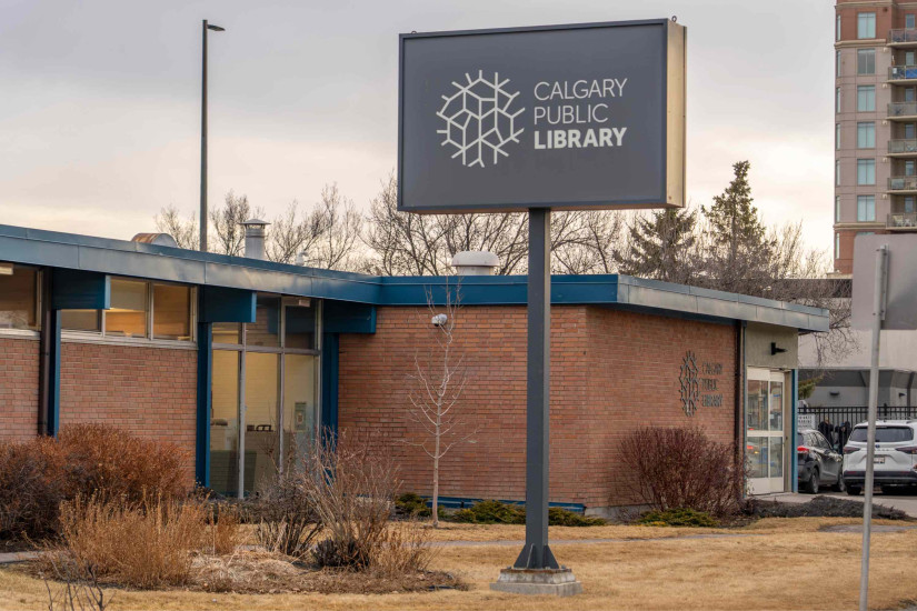 Louise Riley Library building exterior with a large sign showing the Calgary Library Logo