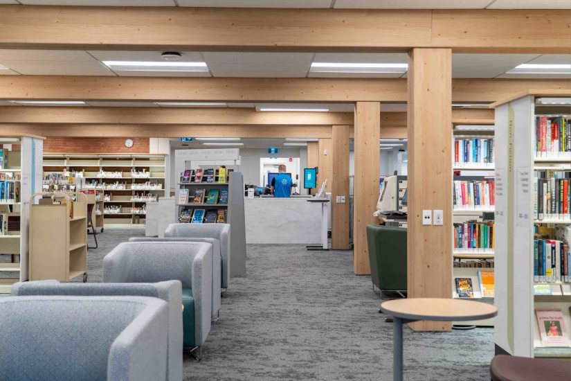 Louise Riley wooden beams, cushioned seating, bookshelves and the membership desk